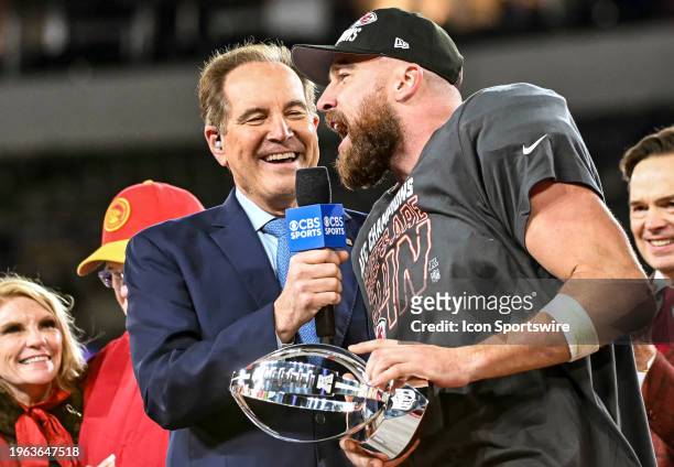 Kansas City Chiefs tight end Travis Kelce holds the Lamar Hunt trophy and is interviewed by CBS Sportcaster, Jim Nantz, following the Kansas City...