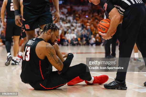 Houston Cougars forward J'Wan Roberts sites on the floor after hurting his ankle during the Big 12 college basketball game between Texas Longhorns...