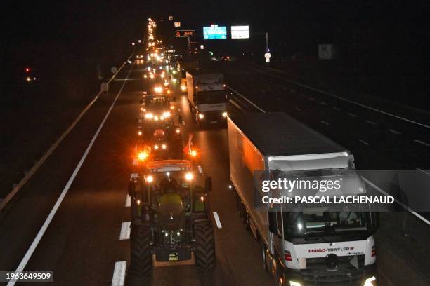 Farmers drive their tractors on the A20 highway near Limoges, on January 30 on their way to Rungis wholesale food market amid nationwide protests...