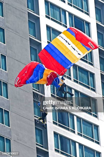 Sri Lankan paratroopers entangle during the Independence Day parade rehearsal in Colombo on January 30 troopers got injured after crashing onto a...