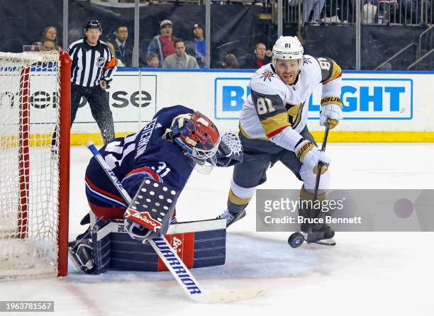 Igor Shesterkin of the New York Rangers loses his mask during the first period against Jonathan Marchessault of the Vegas Golden Knights at Madison...