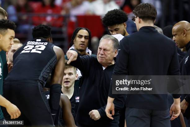Tom Izzo head coach of the Michigan State Spartans during a time out in the first half of the game during the game against the Wisconsin Badgers at...