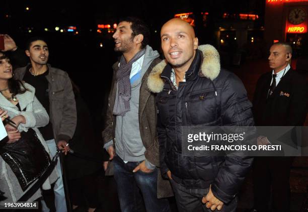 Algerian actors Ramzi Bedia and Eric Judor arrive at the Kinepolis movie theater of Lomme, northern France, on January 26, 2011 during a premiere of...
