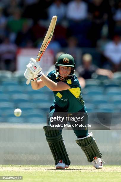Beth Mooney of Australia bats during game one of the Women's T20 International series between Australia and South Africa at Manuka Oval on January...