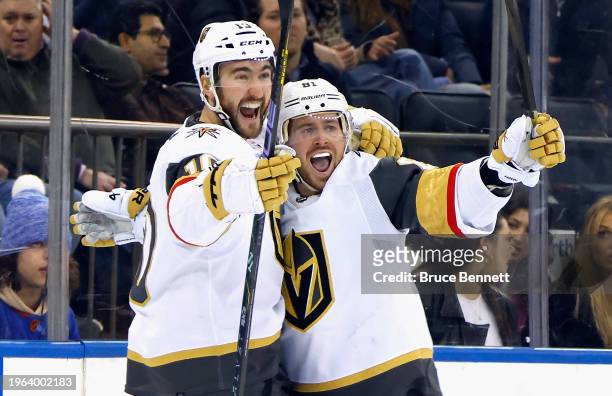 Jonathan Marchessault of the Vegas Golden Knights celebrates his goal at 2:11 of the third period against the New York Rangers and is joined by...