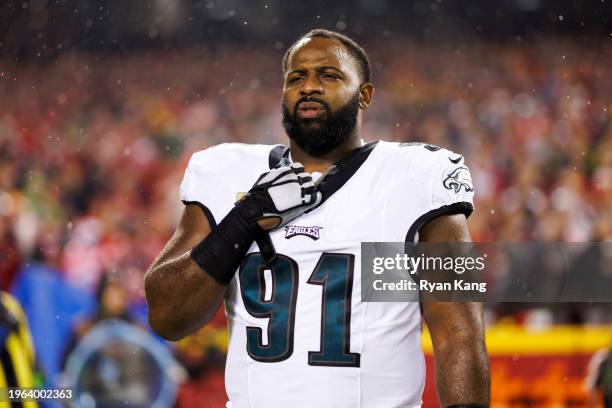 Fletcher Cox of the Philadelphia Eagles looks on from the sideline before an NFL football game against the Kansas City Chiefs at GEHA Field at...