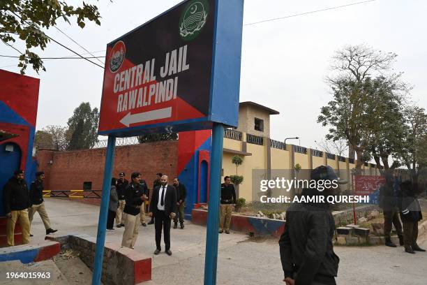 Police personnel stand outside the entrance of Adiala jail during the hearing of jailed former Pakistan's Prime Minister Imran Khan, in Rawalpindi on...