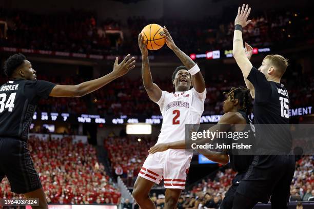 Storr of the Wisconsin Badgers goes in for a score during the second half against the Michigan State Spartans at Kohl Center on January 26, 2024 in...