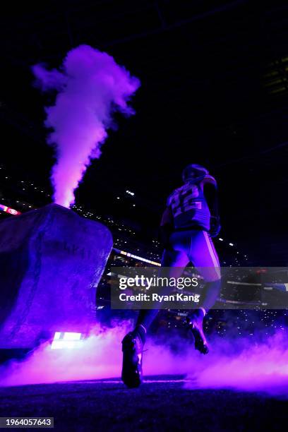 Harrison Smith of the Minnesota Vikings runs onto the field during player introductions before an NFL football game against the San Francisco 49ers...