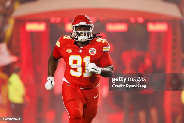 Derrick Nnadi of the Kansas City Chiefs runs onto the field during team entrances prior to an NFL football game against the Denver Broncos at GEHA...