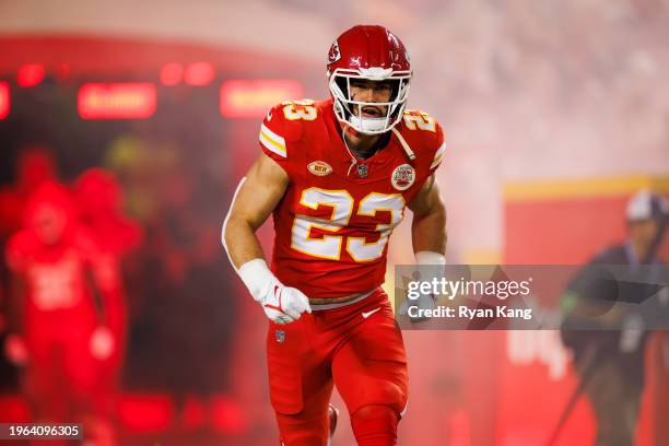 Drue Tranquill of the Kansas City Chiefs runs onto the field during team entrances prior to an NFL football game against the Denver Broncos at GEHA...