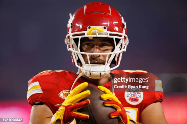 Travis Kelce of the Kansas City Chiefs looks on from the sideline prior to an NFL football game against the Denver Broncos at GEHA Field at Arrowhead...