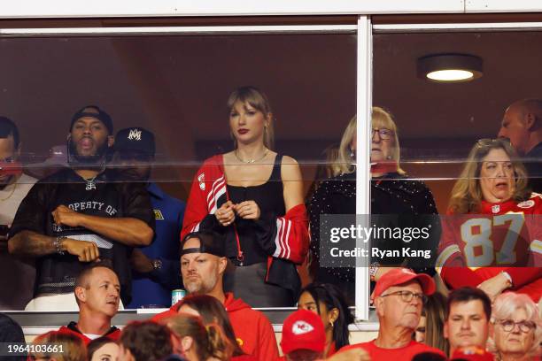 Taylor Swift watches an NFL football game between the Kansas City Chiefs and the Denver Broncos at GEHA Field at Arrowhead Stadium on October 12,...