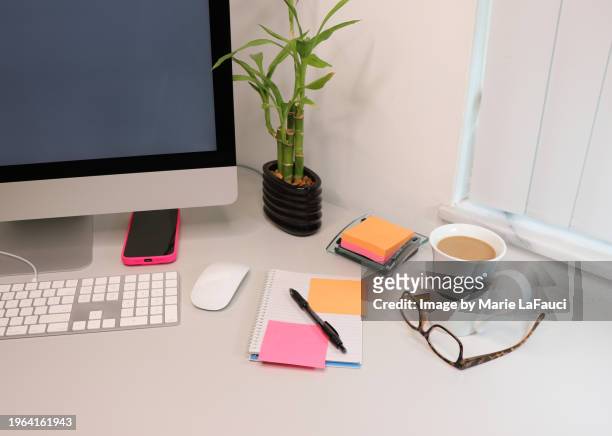 colorful sticky notes on modern office desk with bamboo plant - boca raton florida stock pictures, royalty-free photos & images