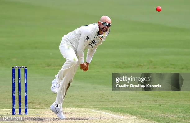 Nathan Lyon of Australia bowls during day three the Second Test match in the series between Australia and West Indies at The Gabba on January 27,...