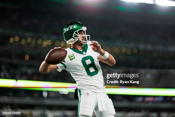 Aaron Rodgers of the New York Jets looks to throw a pass during pregame warmups prior to an NFL football game against the Buffalo Bills at MetLife...