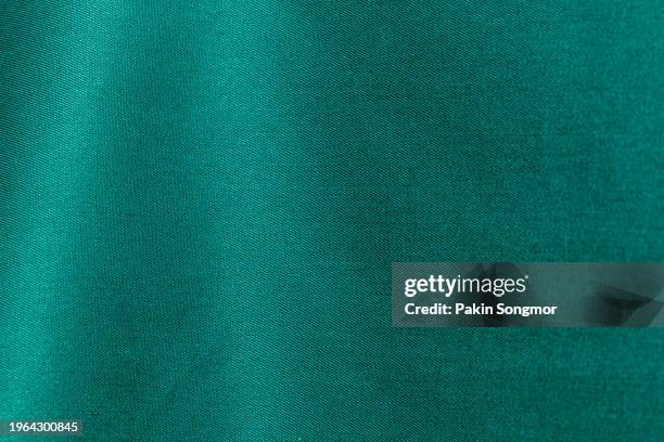 green color fabric cloth polyester texture and textile background. - green shirt stock pictures, royalty-free photos & images