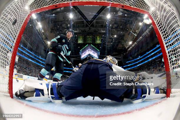 Yanni Gourde of the Seattle Kraken watches a goal by Eeli Tolvanen against Jordan Binnington of the St. Louis Blues during the second period at...