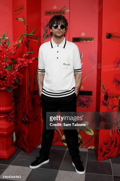 Louis Tomlinson arrives at Piper Heidsieck during the Australian Open on January 27, 2024 in Melbourne, Australia.