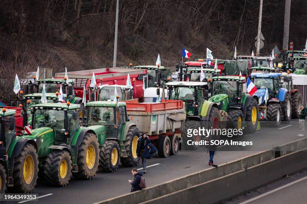 Tractors seen blocking the A15 highway on the outskirts of Paris, during the farmers' strike. Agriculture workers block eight of the main access...