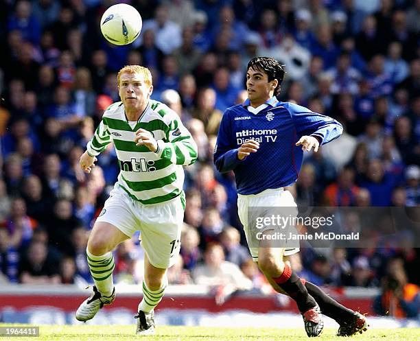 Neil Lennon of Celtic reaches the ball ahead of Mikel Arteta of Rangers during the Bank of Scotland Scottish Premier League match between Glasgow...