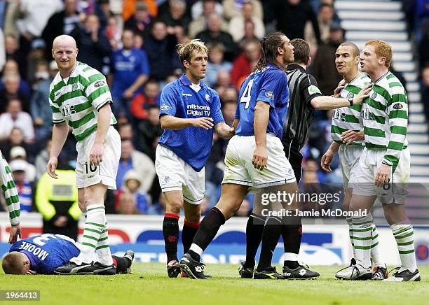 Tempers flare up between Lorenzo Amoruso of Rangers and Neil Lennon of Celtic during the Bank of Scotland Scottish Premier League match between...