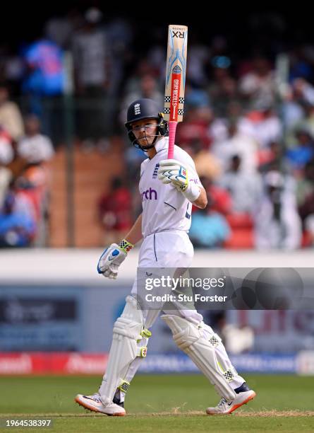 Ollie Pope of England raises his bat as he acknowledges reaching his half-century, after scoring 50 runs, during Day Three of the 1st Test Match...