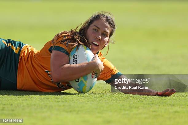 Charlotte Caslick of Australia crosses for a try during the 2024 Perth SVNS women's match between New Zealand and Australia at HBF Park on January...
