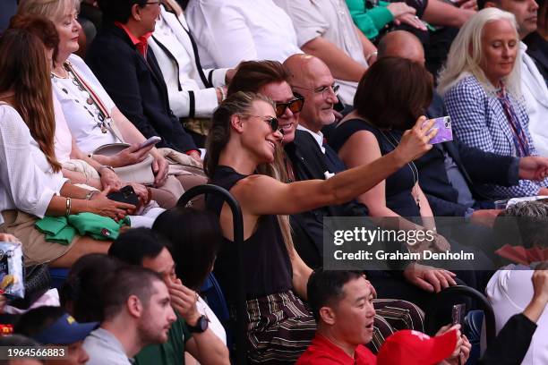 Christian Wilkins and Richard Wilkins look on ahead of the Women's Singles Final match between Qinwen Zheng of China and Aryna Sabalenka during the...