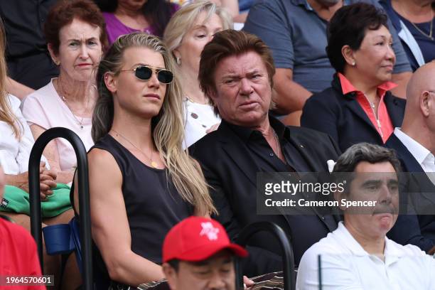 Christian Wilkins and Richard Wilkins look on ahead of the Women's Singles Final match between Qinwen Zheng of China and Aryna Sabalenka during the...