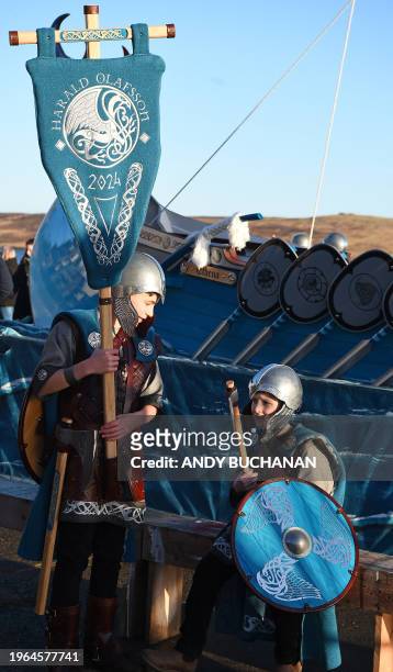 Members of the Up Helly Aa 'Jarl Squad' prepare to parade through the streets of in Lerwick, Shetland Islands on January 30, 2024 before the Up Helly...