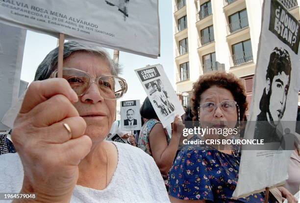 Families of victims of Gen. Augusto Pinochet march in Santiago 28 November. Familiares de Detenidos Desaparecidos durante el gobierno del Gen....