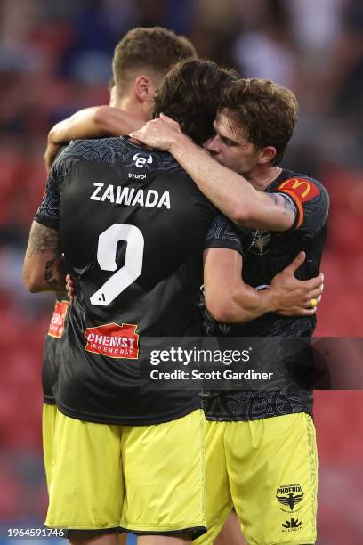 Oskar Zawada, Alex Rufer of the Phoenix ccelebrate the teams win during the A-League Men round 14 match between Newcastle Jets and Wellington Phoenix...