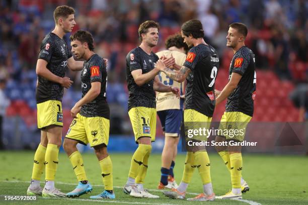 Phoenix players celebrate their win during the A-League Men round 14 match between Newcastle Jets and Wellington Phoenix at McDonald Jones Stadium,...