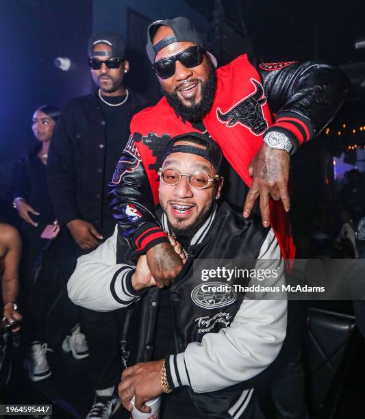 Jeezy and Boston George partying at The Address Bar & Grill on January 27, 2024 in Houston, Texas.