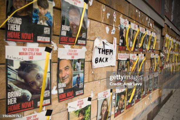 Wall with photos of hostages held by Hamas in the Gaza Strip on January 30, 2024 in Tel Aviv, Israel. The Israeli prime minister's office referred to...
