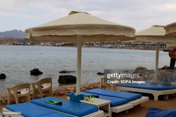 Sun beds where tourists relax on the beach of the bay of Sharm el-Maya, on the shore of the Red Sea in Sharm El Sheikh, Egypt.