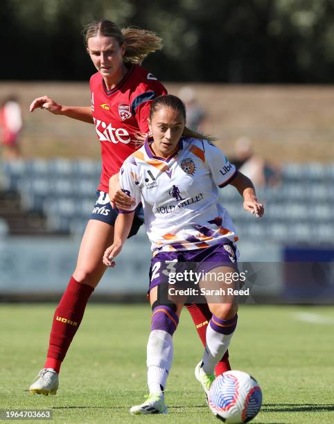 Izzy Dalton of Perth Glory and Chelsea Dawber of Adelaide United during the A-League Women round 14 match between Adelaide United and Perth Glory at...