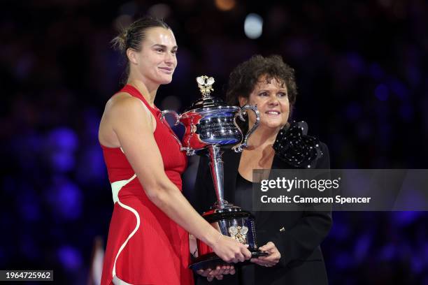 Aryna Sabalenka and Evonne Goolagong Cawley pose with the Daphne Akhurst Memorial Cup during the official presentation after the the Women's Singles...