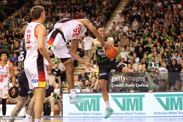 Owen Foxwell of the Phoenix and Keanu Pinder of the Wildcats collide during the round 17 NBL match between South East Melbourne Phoenix and Perth...