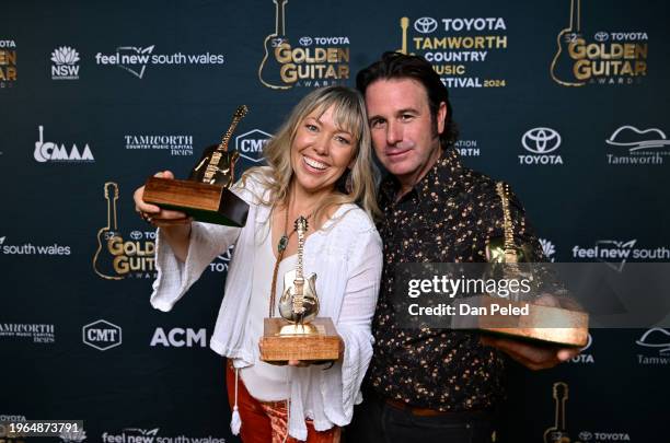 Felicity Urquhart and Josh Cunningham pose with three Golden Guitar Awards, including the Traditional Country Album of the Year award, at the 2024...