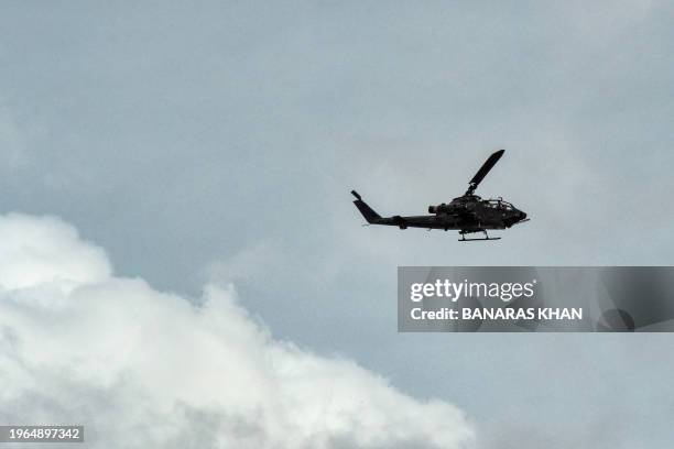 An army helicopter conducts a search operation following an attack by armed separatist group Balochistan Liberation Army at central Bolan district in...