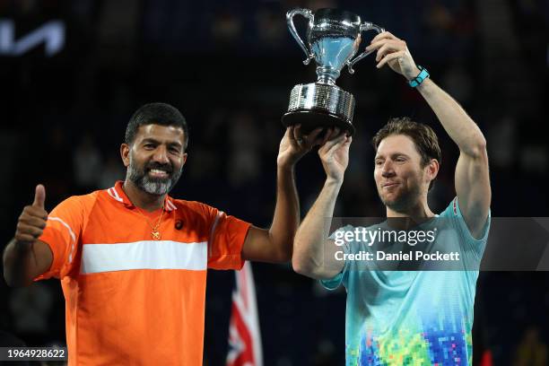 Rohan Bopanna of India and Matthew Ebden of Australia pose with the championship trophy after their Men’s Doubles Final match against Simone Bolelli...