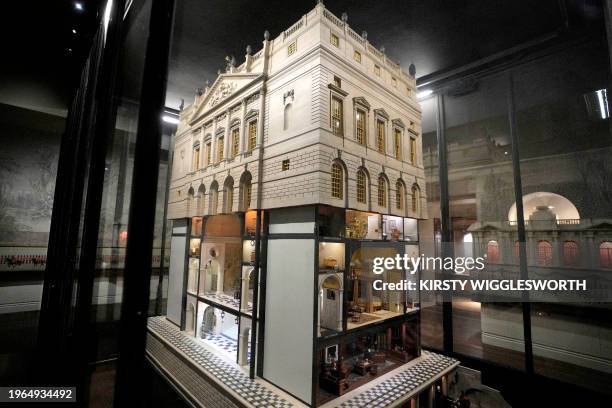 Queen Mary's Dolls' House is pictured inside a glass cabinet, during a reception hosted by Britain's Queen Camilla, for authors, illustrators and...