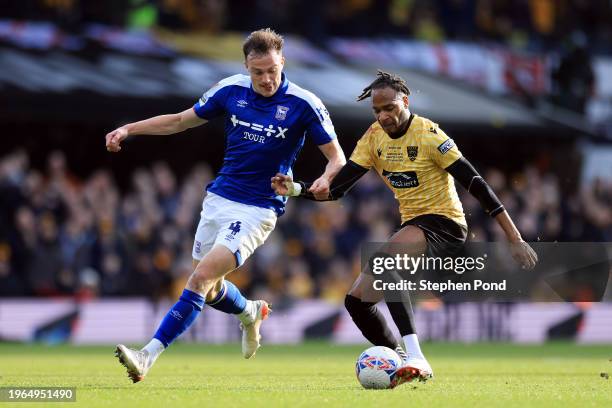 Lamar Reynolds of Maidstone United on the ball whilst under pressure from George Edmundson of Ipswich Town during the Emirates FA Cup Fourth Round...