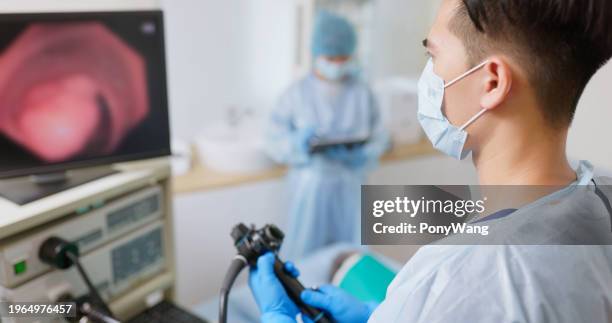doctor do colonoscopy tumor surgery - colorectal cancer stockfoto's en -beelden