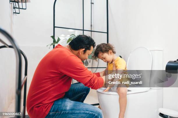 potty training in progress - child urinating stock pictures, royalty-free photos & images