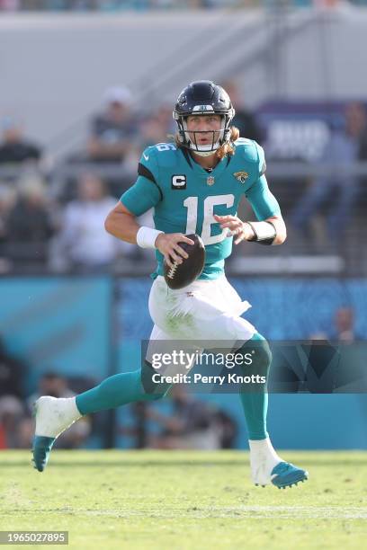 Trevor Lawrence of the Jacksonville Jaguars runs upfield during a game against the San Francisco 49ers at TIAA Bank Field on November 21, 2021 in...