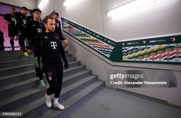 Harry Kane of Bayern Munich walks through the players tunnel prior ahead of the warm up prior to the Bundesliga match between FC Augsburg and FC...