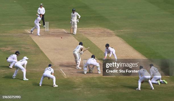 England bowler Joe Root bowls to batsman Mohammed Siraj on his hat trick ball as the fielders field in close to the bat during day three of the 1st...